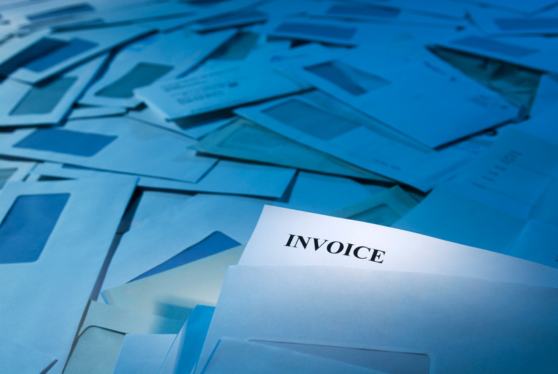 invoice factoring - pile of invoices