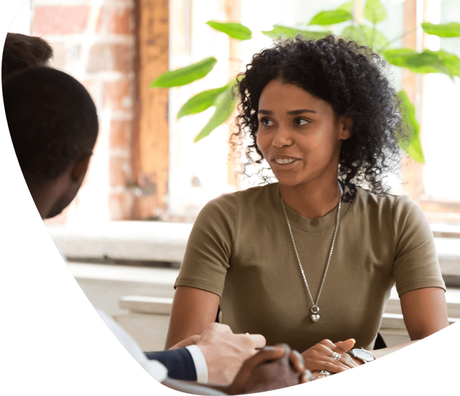 woman discussing with colleagues in office