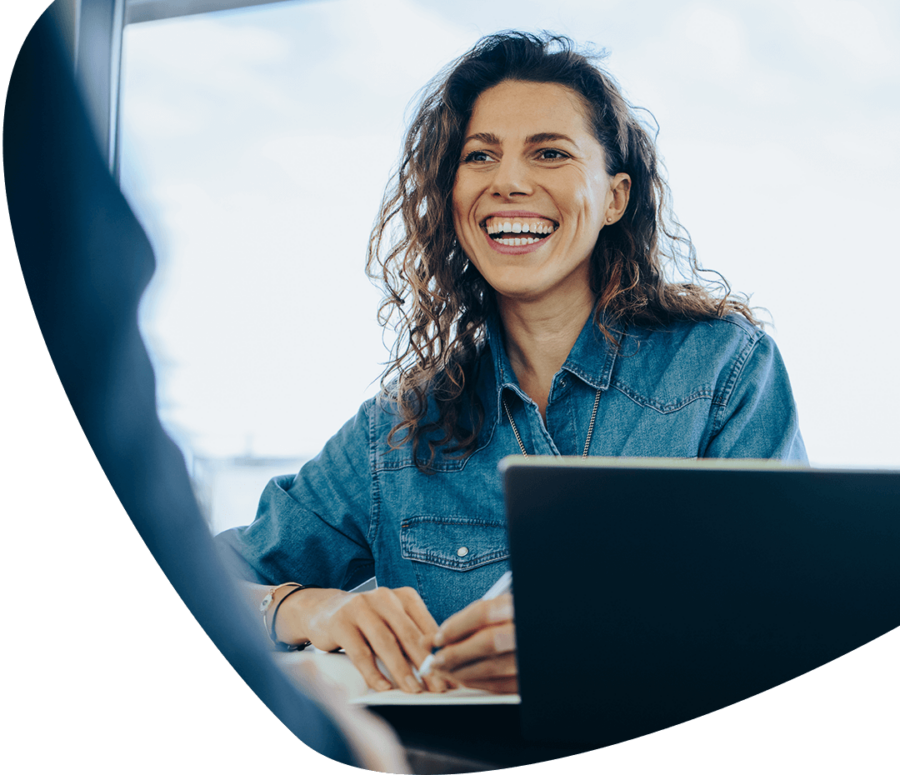 smiling woman taking notes