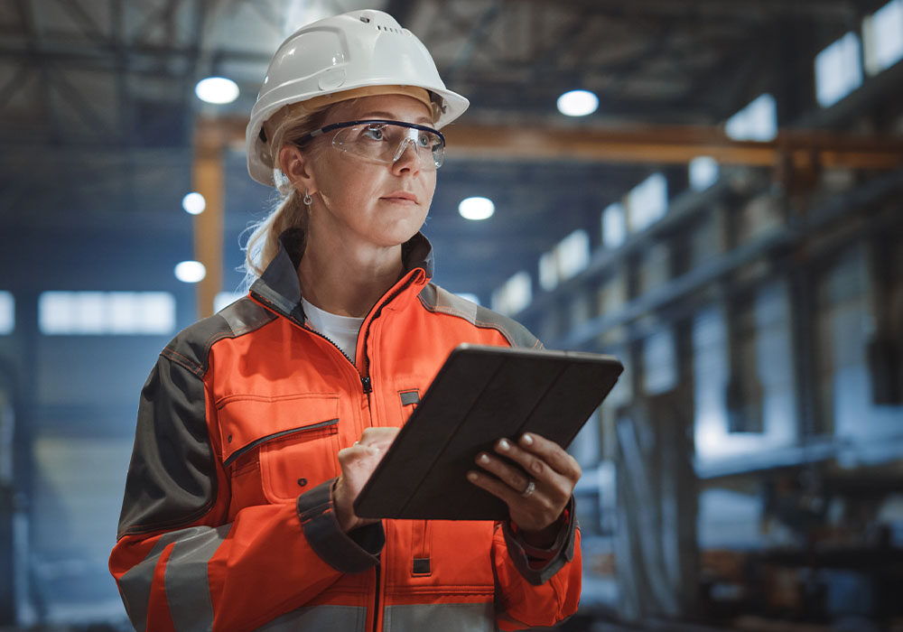 woman in hard hat with clipboard