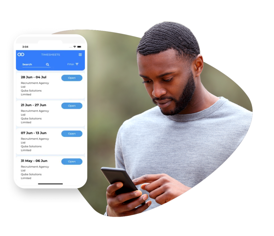 man looking at phone with screenshot of QUBA timesheets