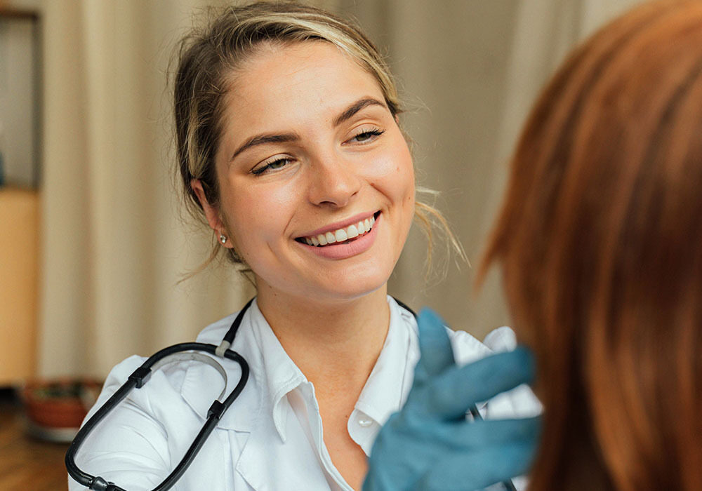 female doctor checking patient